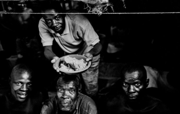 Inmates prepare food. Inmates prepare food.