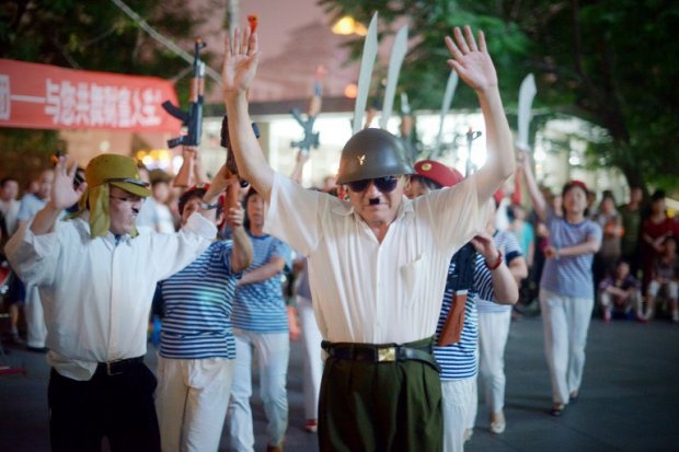 Chinese civilians take part in an event marking the start of the war with Japan. Beijing, July 7, 2014. (AFP Photo/Wang Zhao) Chinese civilians take part in an event marking the start of the war with Japan. Beijing, July 7, 2014. (AFP Photo/Wang Zhao)