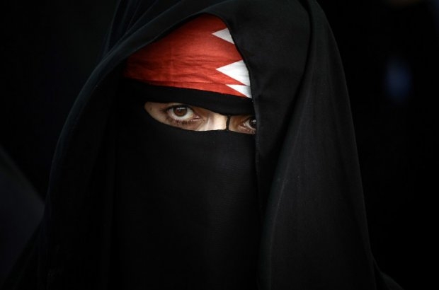 A Bahraini woman poses for a picture during an anti-government rally in the village of Abu Saiba, west of Manama, on August 23, 2013 A Bahraini woman poses for a picture during an anti-government rally in the village of Abu Saiba, west of Manama, on August 23, 2013