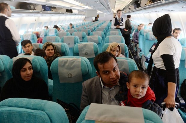 Abuzar sits with his cousin Turaj in a plane moments before leaving Kabul for Canada Abuzar sits with his cousin Turaj in a plane moments before leaving Kabul for Canada