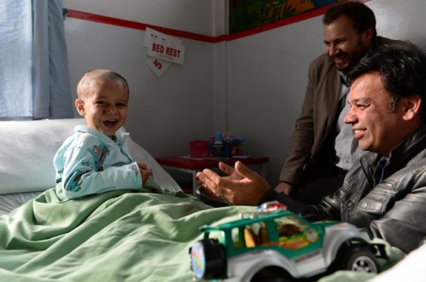 Abuzar plays during a visit by his uncle Bashir Mirzad Abuzar plays during a visit by his uncle Bashir Mirzad