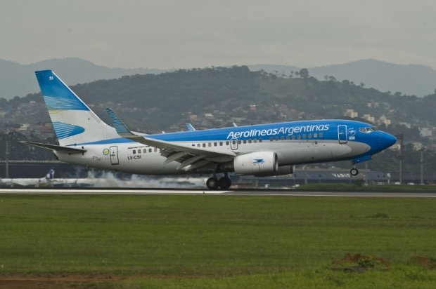 An Aerolineas Argentinas airliner lands at Sao Paulo International Airport, on November 2013. Chequeado.com has declared "exagerated" a claim by the state-run airline thait it had put all its financial records on its website An Aerolineas Argentinas airliner lands at Sao Paulo International Airport, on November 2013. Chequeado.com has declared "exagerated" a claim by the state-run airline thait it had put all its financial records on its website