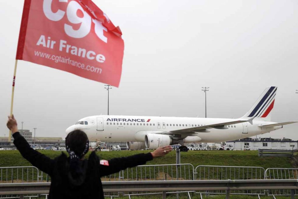 An Air France employee protests planned job cuts. An Air France employee protests planned job cuts.