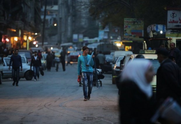 Syrians shop in the al-Midan neighbourhood on the government-held side of Aleppo on November 16, 2014 Syrians shop in the al-Midan neighbourhood on the government-held side of Aleppo on November 16, 2014