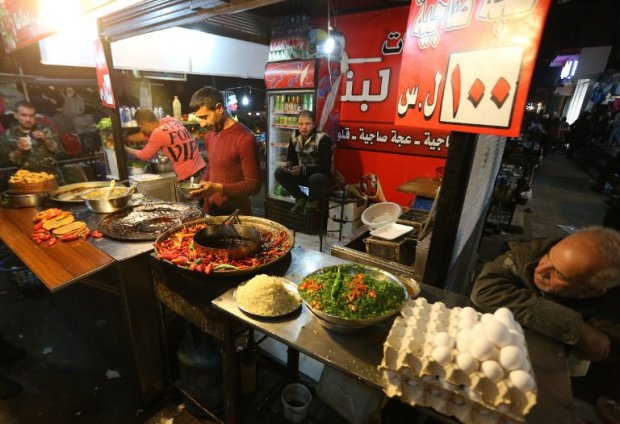 A Syrian man sells traditional food in Aleppo on November 15, 2014 A Syrian man sells traditional food in Aleppo on November 15, 2014