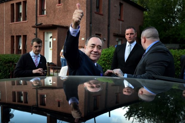 Scotland's First Minister Alex Salmond gestures as he leaves following a visit to a housing estate in Glasgow on September 13, 2014 Scotland's First Minister Alex Salmond gestures as he leaves following a visit to a housing estate in Glasgow on September 13, 2014