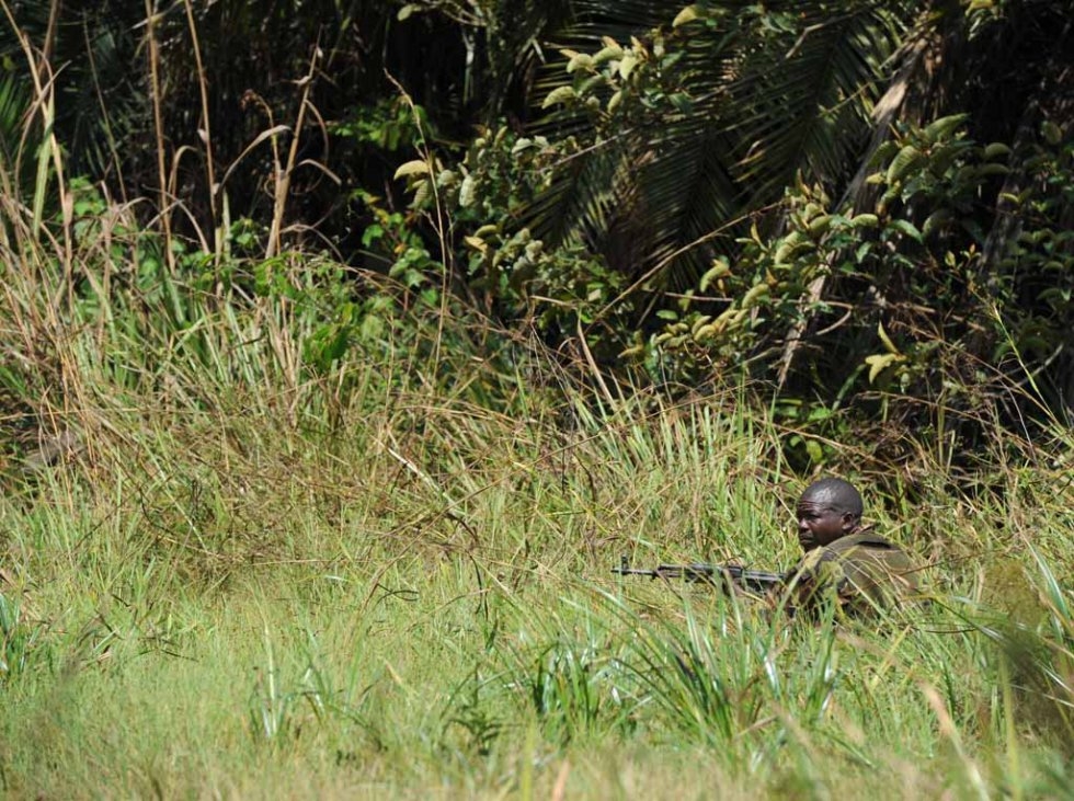 A ranger takes up position after being deployed to a remote part of the park. A ranger takes up position after being deployed to a remote part of the park.