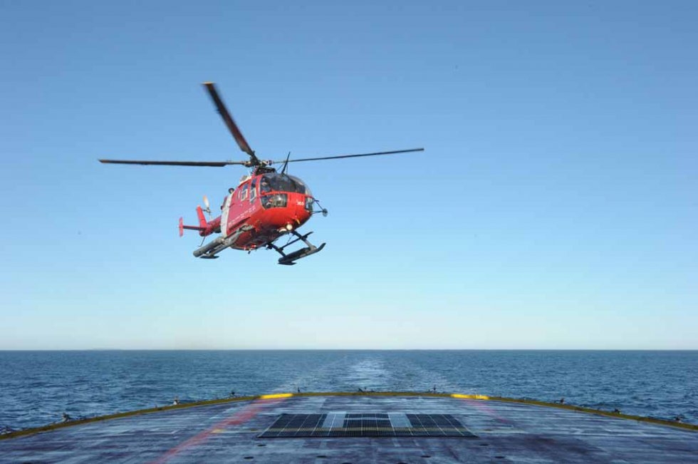 A helicopter approaches the ship A helicopter approaches the ship