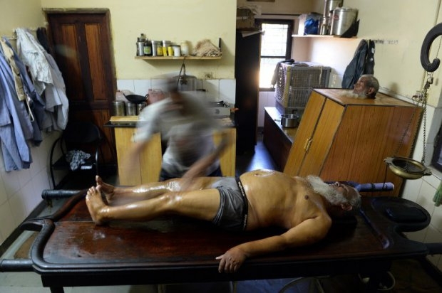 Bhopal gas disaster survivor Mushtaq Ahmed, 60, receives an oil rub as part of rehabilitation using traditional Ayurvedic methods Bhopal gas disaster survivor Mushtaq Ahmed, 60, receives an oil rub as part of rehabilitation using traditional Ayurvedic methods