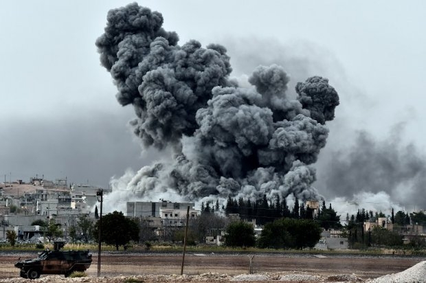 Smoke rises after a strike on Kobane, seen from the Turkish-Syrian border on October 12, 2014 Smoke rises after a strike on Kobane, seen from the Turkish-Syrian border on October 12, 2014