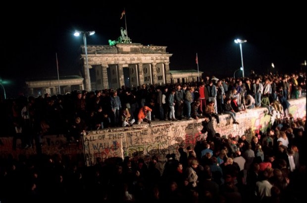 Berliners crowd atop the Berlin Wall near the Brandenburg Gate on 11 November 1989 Berliners crowd atop the Berlin Wall near the Brandenburg Gate on 11 November 1989