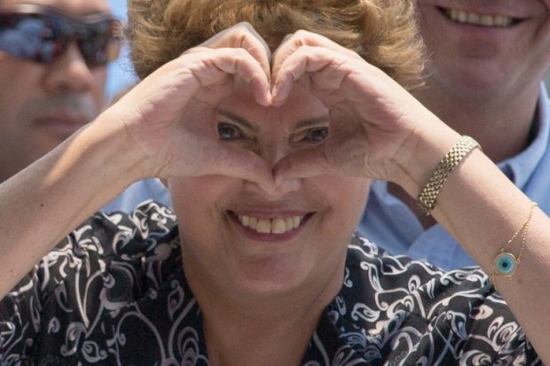 Rousseff makes a heart-shaped sign during her campaign in Rio de Janeiro on October 20, 2014 Rousseff makes a heart-shaped sign during her campaign in Rio de Janeiro on October 20, 2014