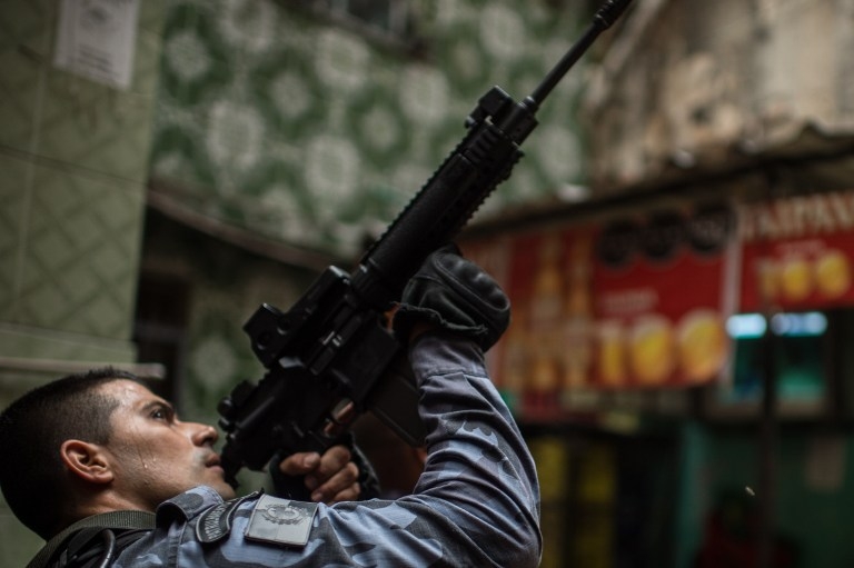 Military police commandos on patrol in Rio's Mare Complex shantytown on April 1, 2015. Military police commandos on patrol in Rio's Mare Complex shantytown on April 1, 2015.