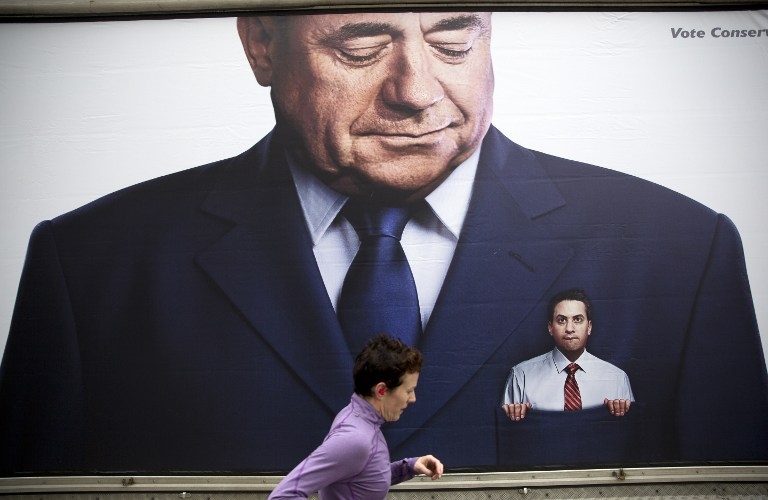 A lorry displays a Conservative poster picturing Labour Party Leader Ed Miliband in the pocket of former Scottish First Minister Alex Salmond, in Birmingham, central England on March 14, 2015 A lorry displays a Conservative poster picturing Labour Party Leader Ed Miliband in the pocket of former Scottish First Minister Alex Salmond, in Birmingham, central England on March 14, 2015