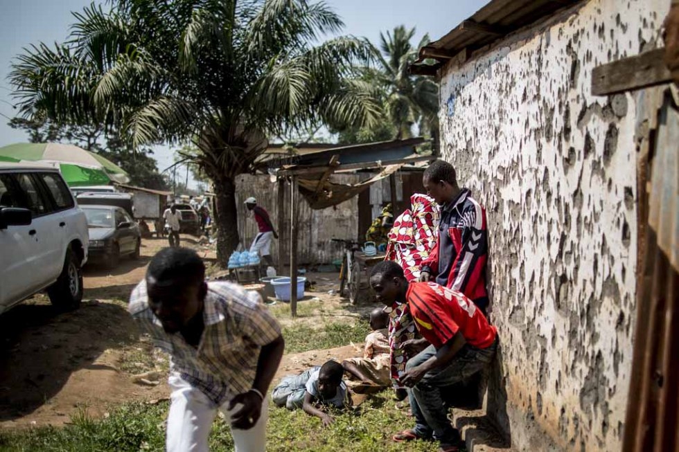 Civilians take cover amid gunfire at the Baya Dombia school. Civilians take cover amid gunfire at the Baya Dombia school.