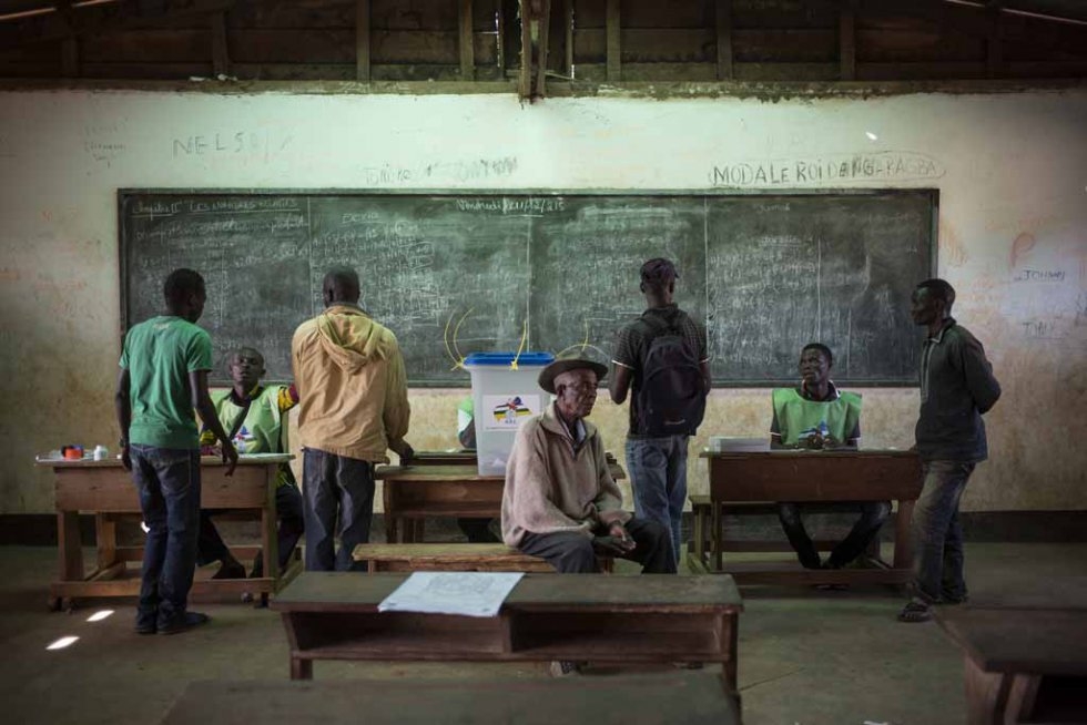 Voters cast their ballots at a polling station in Bangui. Voters cast their ballots at a polling station in Bangui.