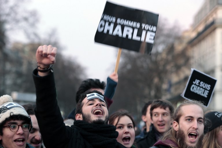 Marchers with a sign reading 'We are all Charlie' in Paris on January 11, 2015 Marchers with a sign reading 'We are all Charlie' in Paris on January 11, 2015