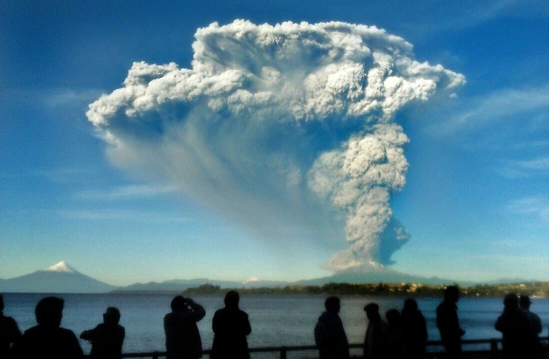 A picture taken with a cellphone shows people watching the Calbuco from Puerto Varas on April 22 A picture taken with a cellphone shows people watching the Calbuco from Puerto Varas on April 22