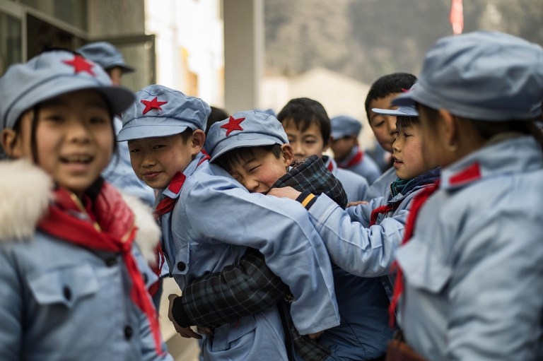 Children wait to enter their classroom at the Beichuan Red Army school on January 21, 2015 Children wait to enter their classroom at the Beichuan Red Army school on January 21, 2015
