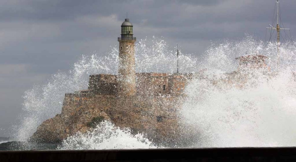 A wave breaks against the Malecon, January, 2008. A wave breaks against the Malecon, January, 2008.