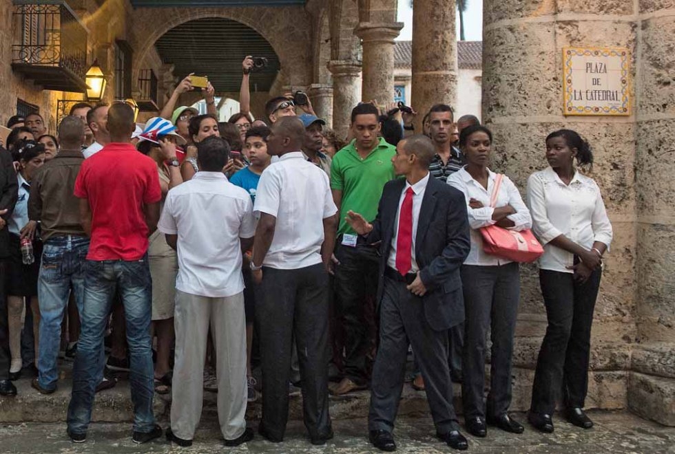 Cuban security agents watch over the crowd ahead of Obama's tour of Old Havana on March 20, 2016. Cuban security agents watch over the crowd ahead of Obama's tour of Old Havana on March 20, 2016.