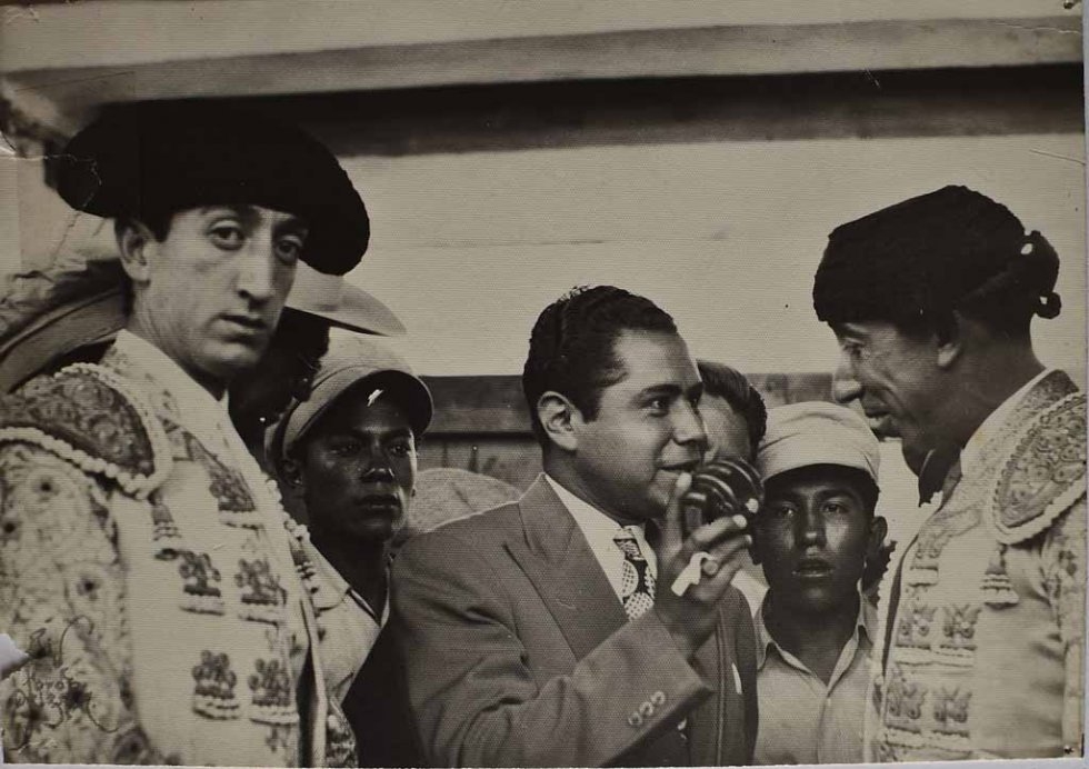 Don Neto interviews bullfighters, with Spain's great Manolete is pictured on the left, looking into the camera. (Photo courtesy of Don Neto) Don Neto interviews bullfighters, with Spain's great Manolete is pictured on the left, looking into the camera. (Photo courtesy of Don Neto)