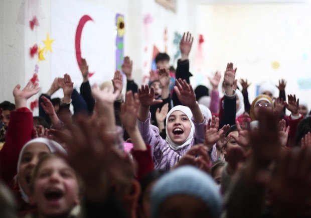 Children at an event organised by the Syrian Arab Red Crescent in the rebel bastion of Douma Children at an event organised by the Syrian Arab Red Crescent in the rebel bastion of Douma