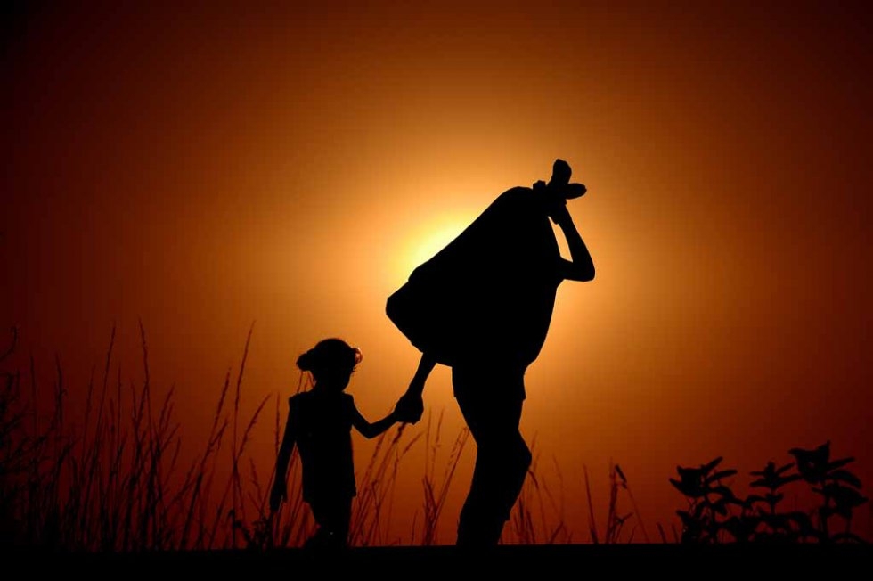 Syrian refugees walk near the Hungarian town of Horgos in early September. Syrian refugees walk near the Hungarian town of Horgos in early September.