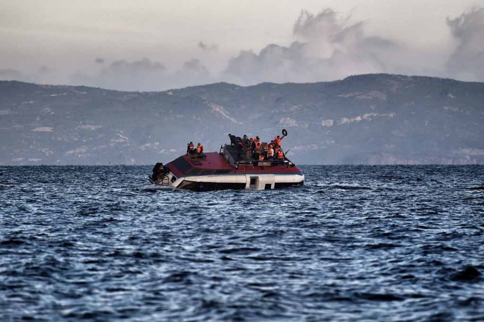 A boat filled with migrants sinks off Lesbos in late October. A boat filled with migrants sinks off Lesbos in late October.
