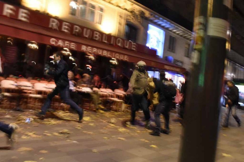 People run in panic after thinking they heard shots near the Place de la Republique on the night of the Paris attacks on November 13, 2015. People run in panic after thinking they heard shots near the Place de la Republique on the night of the Paris attacks on November 13, 2015.