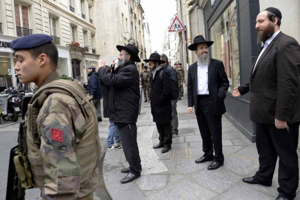 French security forces patrol the Jewish quarter in Paris following Islamist attacks in January. French security forces patrol the Jewish quarter in Paris following Islamist attacks in January.