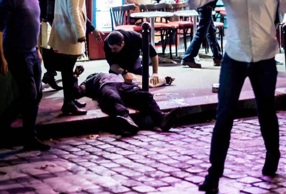 A man lies on the pavement outside the Cafe Bonne Bierre on the night of the November 13 attacks. A man lies on the pavement outside the Cafe Bonne Bierre on the night of the November 13 attacks.