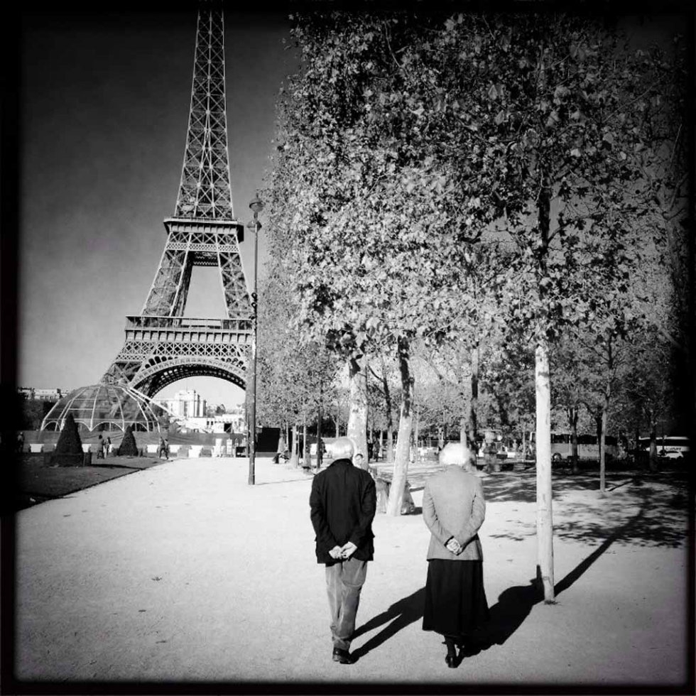 An elderly couple walks near the Eiffel Tower two days after the attacks. An elderly couple walks near the Eiffel Tower two days after the attacks.