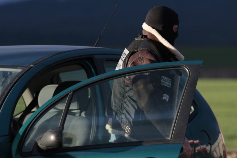 A police officer at a gas station where the Charlie Hebdo suspects were spotted on January 8, 2015 A police officer at a gas station where the Charlie Hebdo suspects were spotted on January 8, 2015