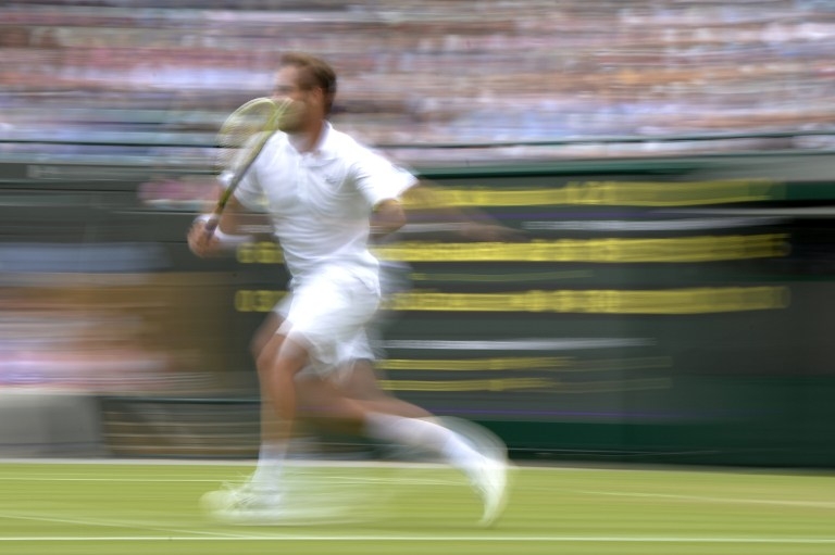 A commonly accepted technique in photojournalism: slow shutter speed and zoom-burst effect, used here to shoot the Frenchman Richard Gasquet at Wimbledon in June 2013 A commonly accepted technique in photojournalism: slow shutter speed and zoom-burst effect, used here to shoot the Frenchman Richard Gasquet at Wimbledon in June 2013