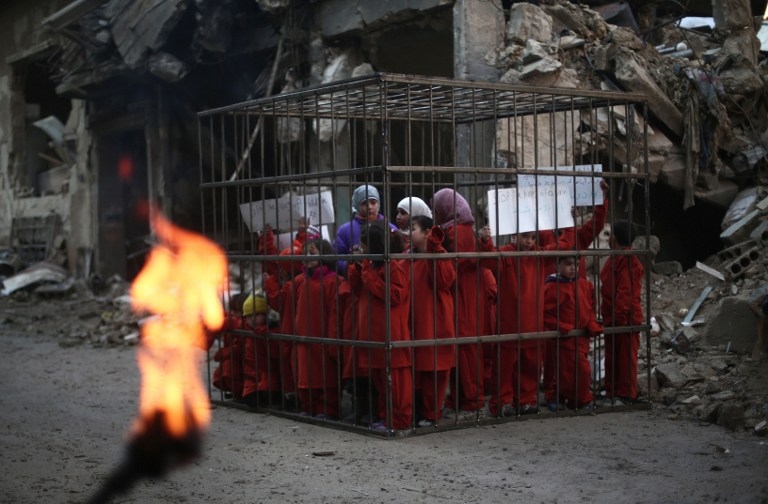 'A photograph is the association of an image and a caption. It's the meeting of those two elements that determines whether a photograph is fake or not'. Here, a picture taken on February 15, 2015 by an AFP freelancer in Douma, outside Damascsus, shows a g 'A photograph is the association of an image and a caption. It's the meeting of those two elements that determines whether a photograph is fake or not'. Here, a picture taken on February 15, 2015 by an AFP freelancer in Douma, outside Damascsus, shows a g