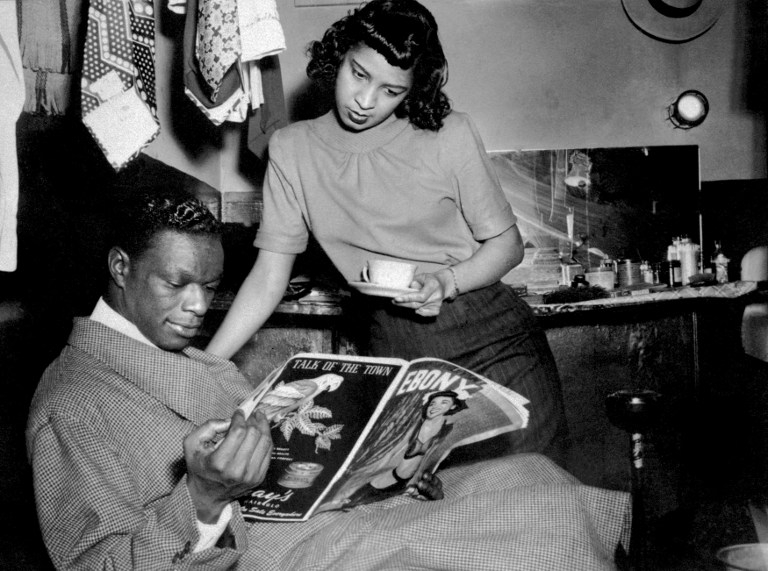Pianist and jazz singer Nat King Cole in his box at the Apollo Theater, New York in the 1950s Pianist and jazz singer Nat King Cole in his box at the Apollo Theater, New York in the 1950s