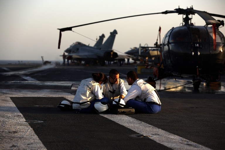 Catapult operators take a rest on the deck of Charles de Gaulle on February 26, 2015 Catapult operators take a rest on the deck of Charles de Gaulle on February 26, 2015