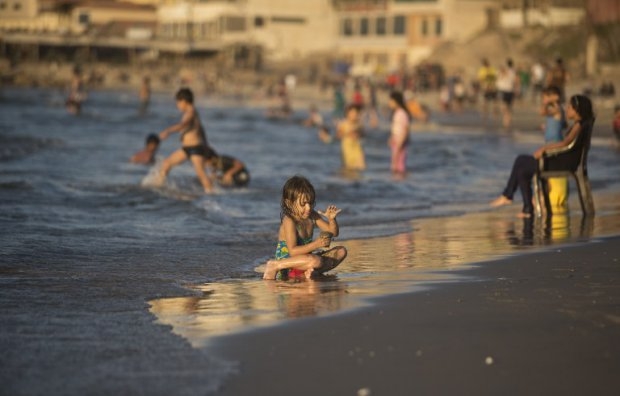 A child playing on the beach in Gaza City on September 7, 2014 A child playing on the beach in Gaza City on September 7, 2014