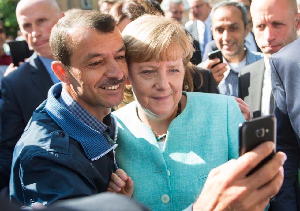 An asylum seeker takes a selfie with German Chancellor Angela Merkel in September, 2015. An asylum seeker takes a selfie with German Chancellor Angela Merkel in September, 2015.