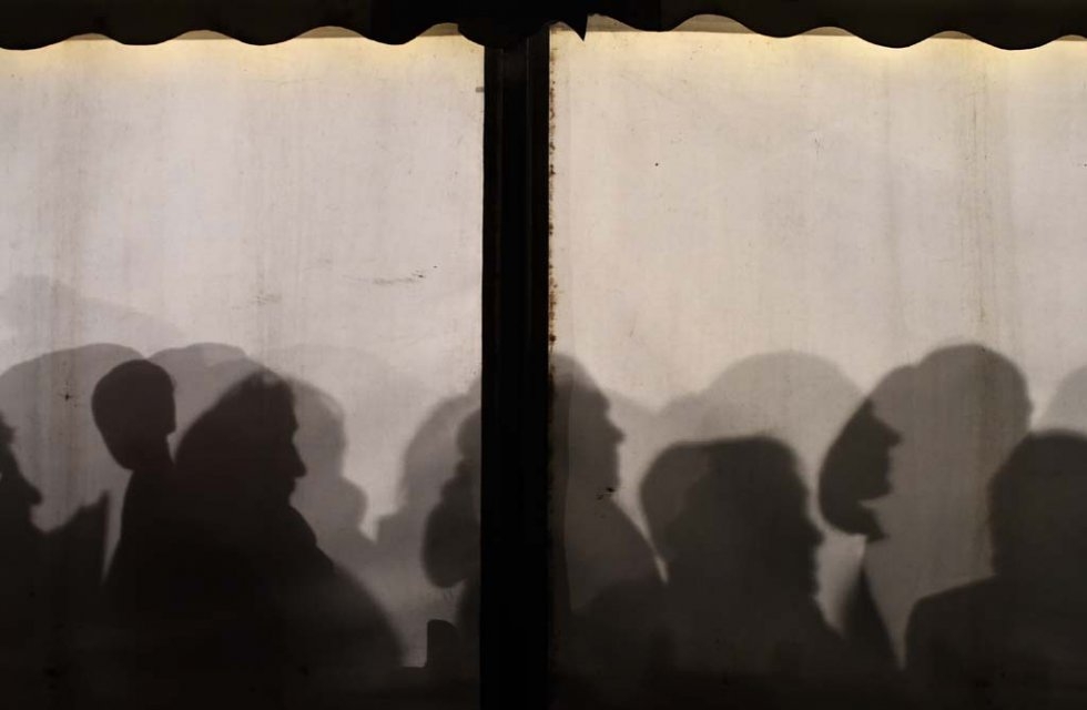 Migrants queue up at a government office in Berlin. January, 2016. Migrants queue up at a government office in Berlin. January, 2016.