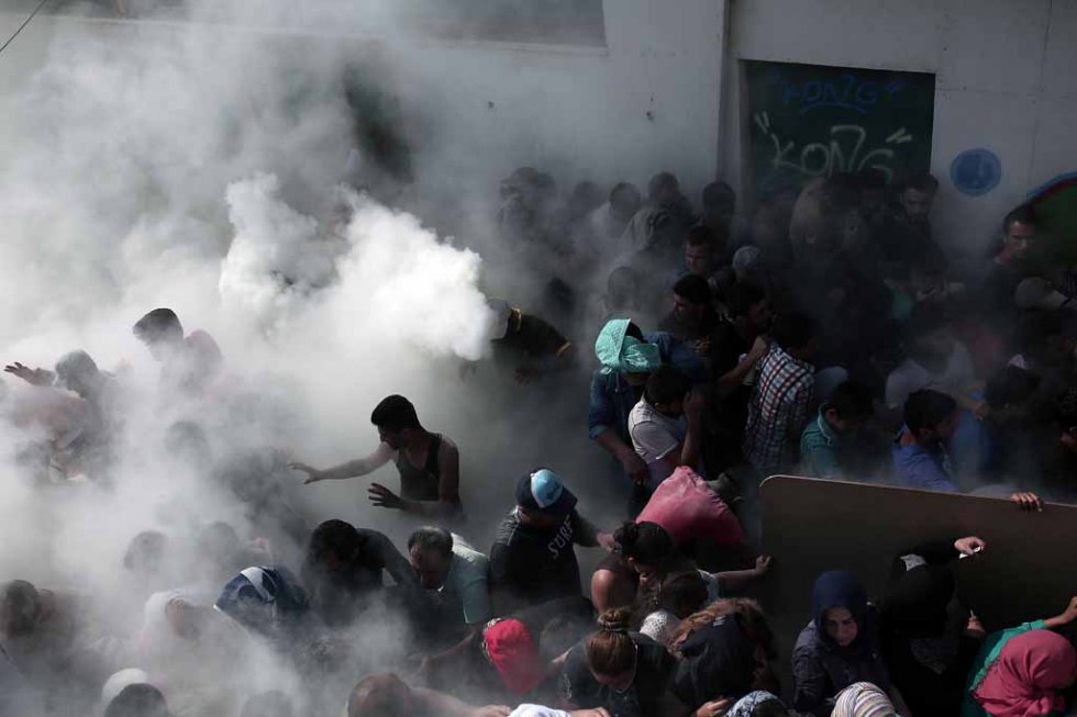Police try to disperse migrants on Kos. August, 2015. Police try to disperse migrants on Kos. August, 2015.