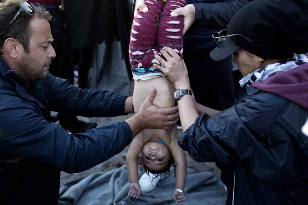 Medics try to revive a boy after a boat carrying him sunk off Lesbos. October, 2015. Medics try to revive a boy after a boat carrying him sunk off Lesbos. October, 2015.
