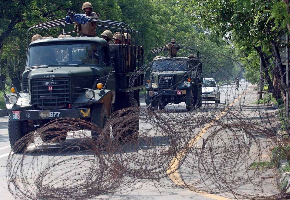 Pakistani soldiers patrol the streets of the violence-hit capital during a break in the curfew imposed in the area of the radical Red Mosque in Islamabad, July 7, 2007 Pakistani soldiers patrol the streets of the violence-hit capital during a break in the curfew imposed in the area of the radical Red Mosque in Islamabad, July 7, 2007