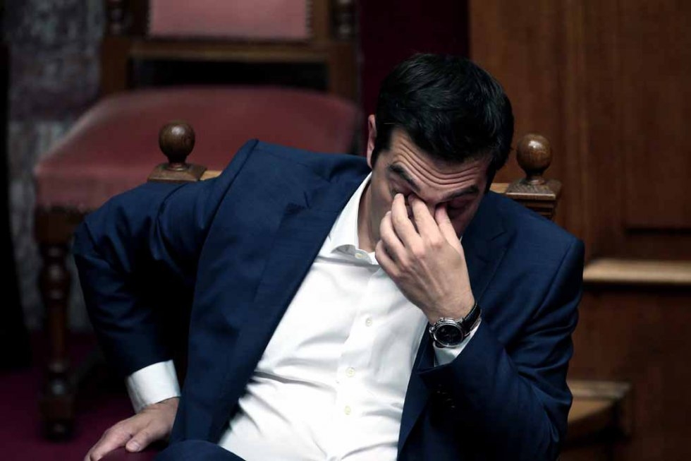 Greek Prime Minister Alexis Tsipras gestures within his address to the Greek Parliament in Athens on June 5, 2015. (AFP PHOTO / ANGELOS TZORTZINIS) Greek Prime Minister Alexis Tsipras gestures within his address to the Greek Parliament in Athens on June 5, 2015. (AFP PHOTO / ANGELOS TZORTZINIS)