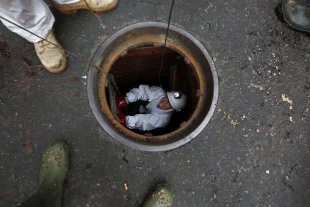 AFP reporter Helen Percival inside a manhole leading to Regent sewer in London AFP reporter Helen Percival inside a manhole leading to Regent sewer in London