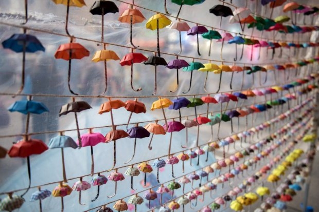 Small paper umbrellas are strung up in a display at the site of protests in the Causeway Bay area of Hong Kong on November 16, 2014 (AFP PHOTO / ALEX OGLE) Small paper umbrellas are strung up in a display at the site of protests in the Causeway Bay area of Hong Kong on November 16, 2014 (AFP PHOTO / ALEX OGLE)