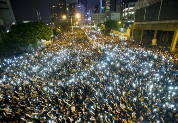 Protestors and student demonstrators hold up their cellphones in a display of solidarity during a protest outside the headquarters of Legislative Council in Hong Kong on September 29, 2014 Protestors and student demonstrators hold up their cellphones in a display of solidarity during a protest outside the headquarters of Legislative Council in Hong Kong on September 29, 2014