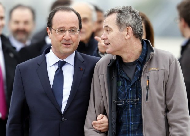 President Francois Hollande welcomes home the freed hostage Didier Francois President Francois Hollande welcomes home the freed hostage Didier Francois