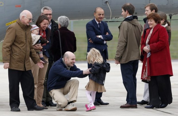 Freed French hostage Nicolas Henin with his family at Villacoublay air base on April 20, 2014. Freed French hostage Nicolas Henin with his family at Villacoublay air base on April 20, 2014.